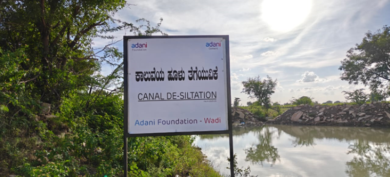 adani-foundation-at-acc-wadi-restores-water-security-for-farmers-in-kundanoor-village-through-canal-de-siltation